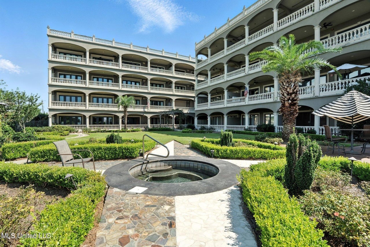 welcome home! welcome to an exquisite tuscan‑inspired oasis at 4640 w beach blvd, gulfport, where european elegance meets gulf coast living. set within the prestigious gated community of tuscan villas, this upscale condo offers an immersive mediterranean retreat right on the shoreline.retreat right on the shoreline of the gulf of america.the heart of tuscan villas is its enchanting courtyard: picture vibrant mediterranean plantings, sculpted hedges, whispering palms, and elegant stone walkways that transport you to a european piazza . a saltwater gunite pool, heated spa, and shaded gazebo create a serene central oasis encircled by flourishing greenery ,built‑in bbq and outdoor kitchen adorn the space—perfect for alfresco gatherings. just steps from your door, a boardwalk leads to the sandy gulf shoreline. enjoy panoramic views of the mississippi sound greeting you from private balconies, forging a seamless connection between indoor sophistication and coastal breezes. step inside to discover soaring 12-foot ceilings, 8-foot solid doors, and opulent crown molding reminiscent of an italian villa .the open‑plan layout flows effortlessly from foyer to living to dining—perfect for entertaining—anchored by a wet bar and framed by granite counters and custom cabinetry .walls finished in warm venetian plaster that deepens the old world ambiance. each bedroom offers it ownen-suite bathroom and upscale comfort, the primary suite is a sanctuary with stone flooring, walk in closets and a jetted soaking tub ands frameless glass shower and spearate vanities. french doors open to your private balcony overlooking lush scenery and the pool area