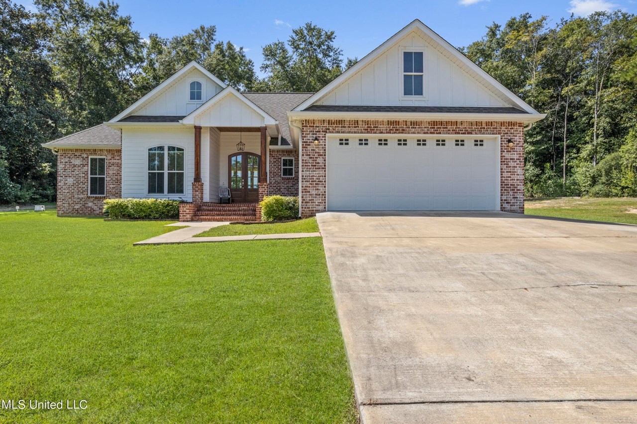 landscaped front of the house this charming 4-bedroom, 2-bath home offers the perfect blend of country living and modern comfort, nestled on a spacious two-acre lot. ideal for a small family, this property features a well-maintained home with quartz countertops, custom cabinets, and a beautifully designed custom shower. additionally, the home includes a 20x20 workshop, making it an excellent choice for those who appreciate both relaxation and functionality. enjoy the tranquility of rural life while still having all the essentials close at hand in this beautiful home.